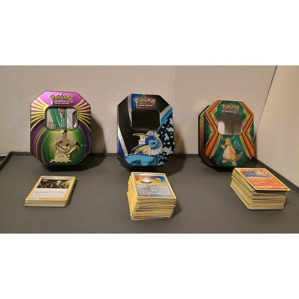 Pokemon TCG Tins Lot 3 Mimikyu Vaporeon Dragonite Assortment  of Trading Cards